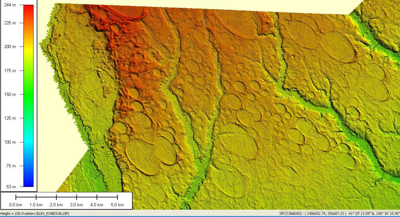 A wider LiDAR elevation strip across the Carolina coastal plain with a distance scale bar — hundreds of overlapping oval depressions visible, all oriented the same direction